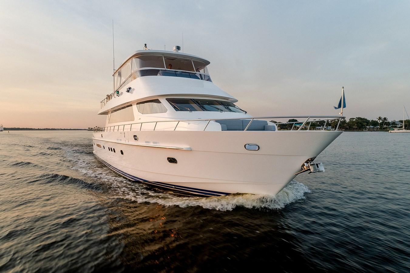 a white boat on the water aboard DARK HORSE Yacht for Sale