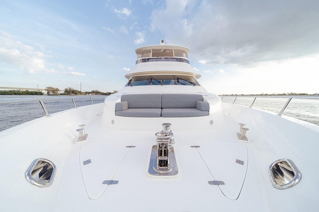 a white ship on a body of water aboard DARK HORSE Yacht for Sale