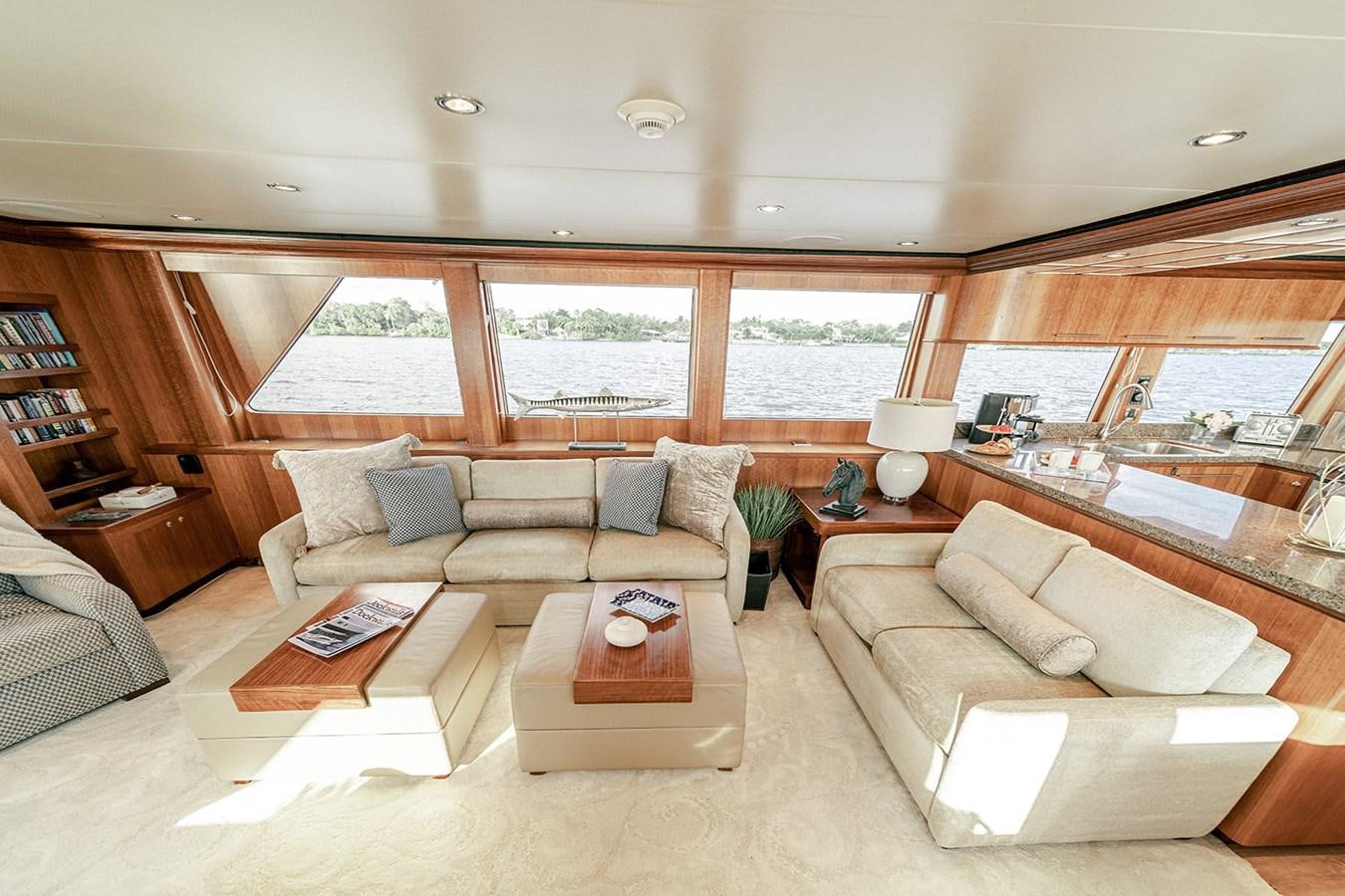 a living room with a large window aboard DARK HORSE Yacht for Sale