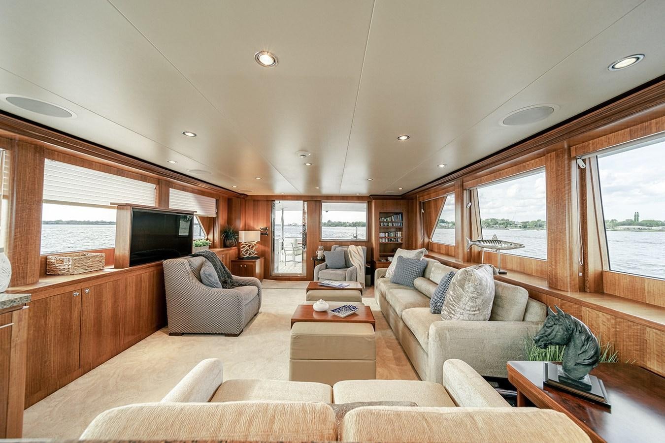 a living room with a couch and a television aboard DARK HORSE Yacht for Sale