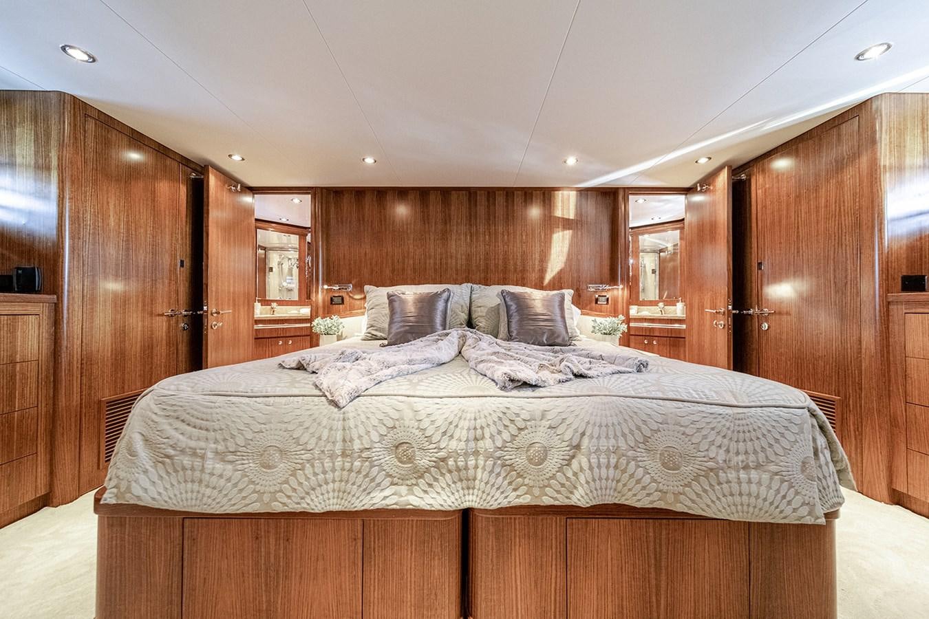 a bed in a wooden room aboard DARK HORSE Yacht for Sale
