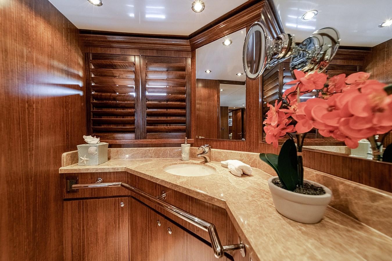 a bathroom with a large mirror aboard DARK HORSE Yacht for Sale
