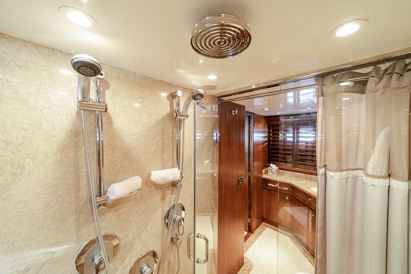 a bathroom with a shower unit and a sink aboard DARK HORSE Yacht for Sale