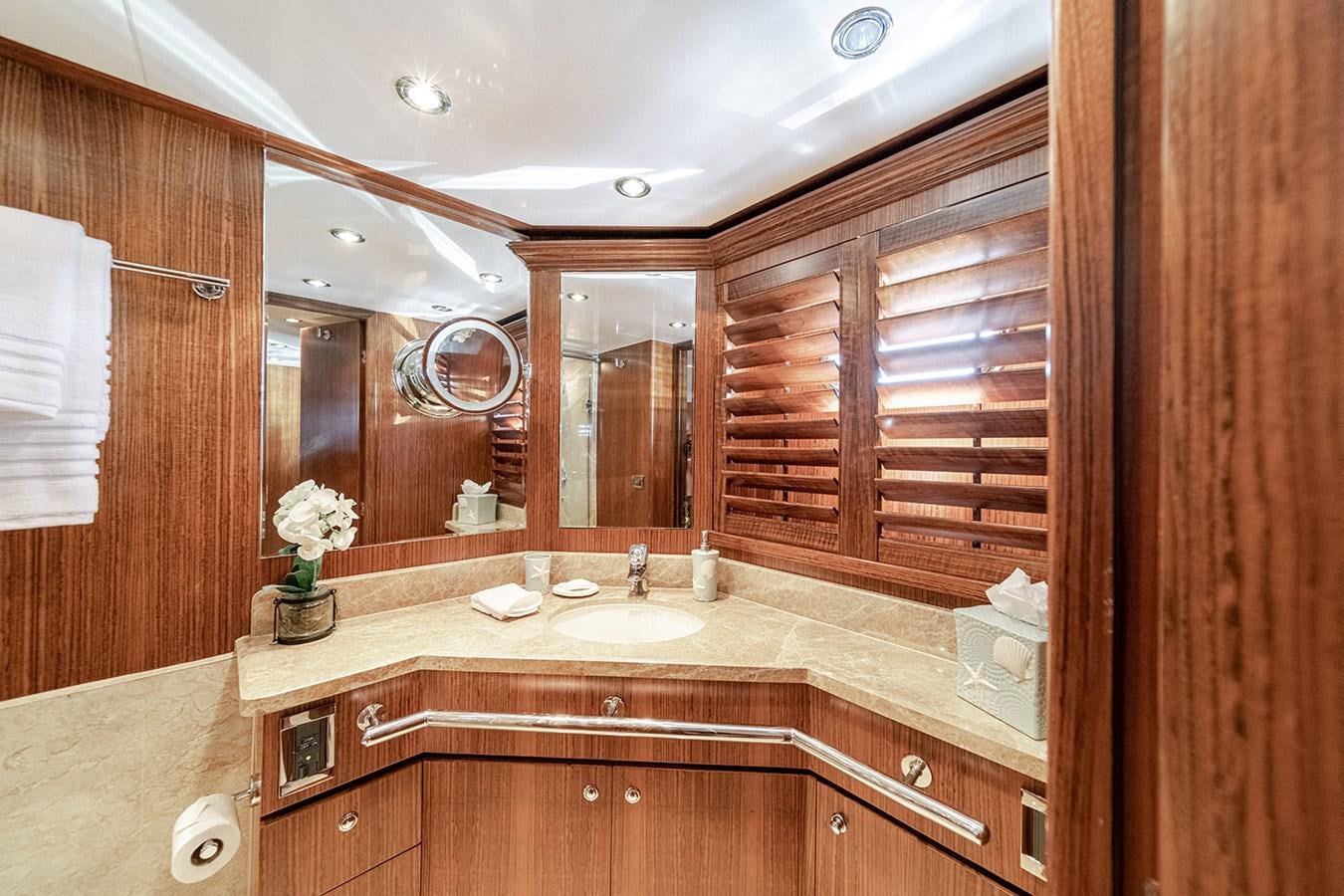 a bathroom with a large mirror aboard DARK HORSE Yacht for Sale