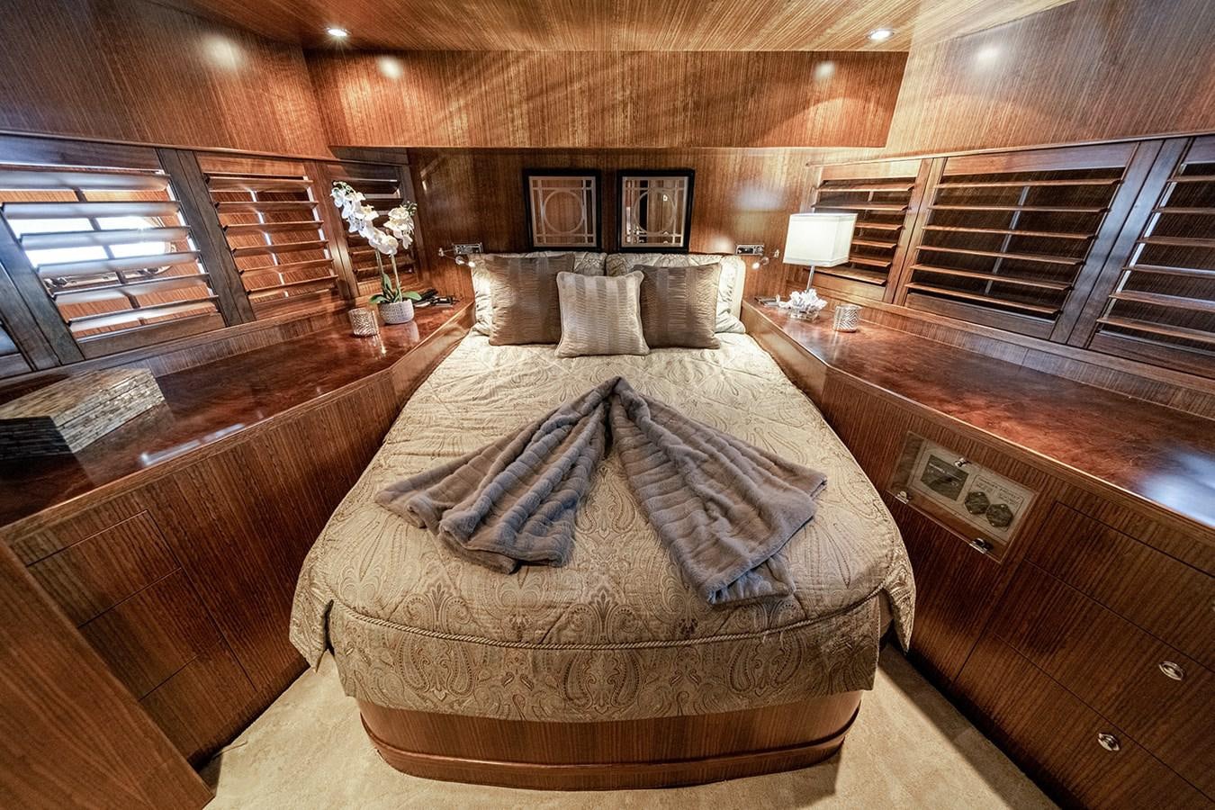 a bed in a room aboard DARK HORSE Yacht for Sale