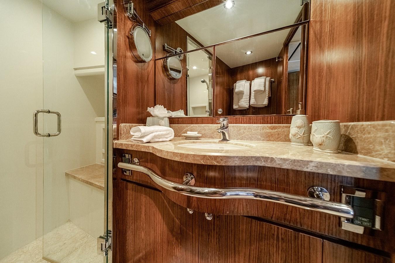 a bathroom with a large mirror aboard DARK HORSE Yacht for Sale
