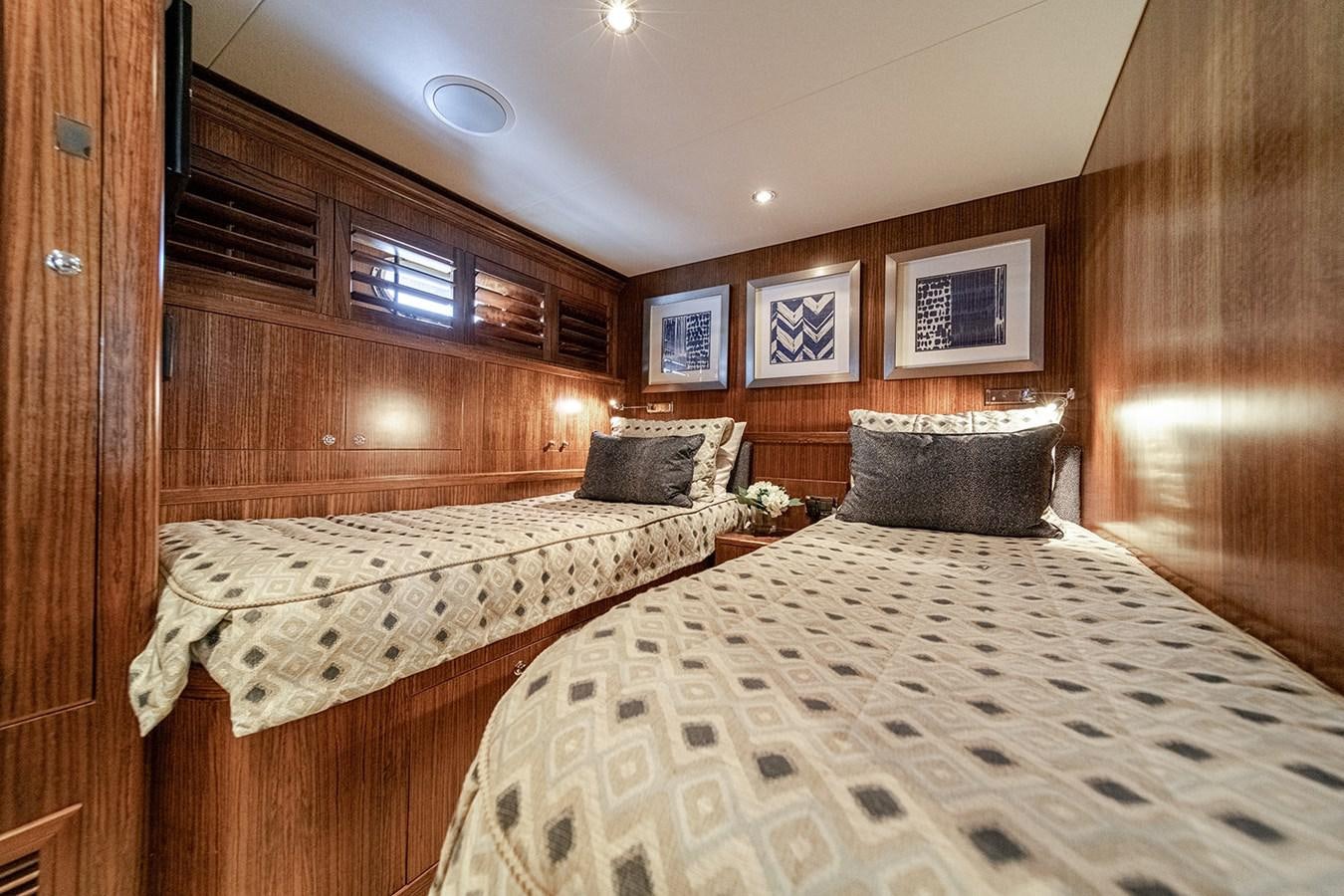a couple of beds in a room aboard DARK HORSE Yacht for Sale