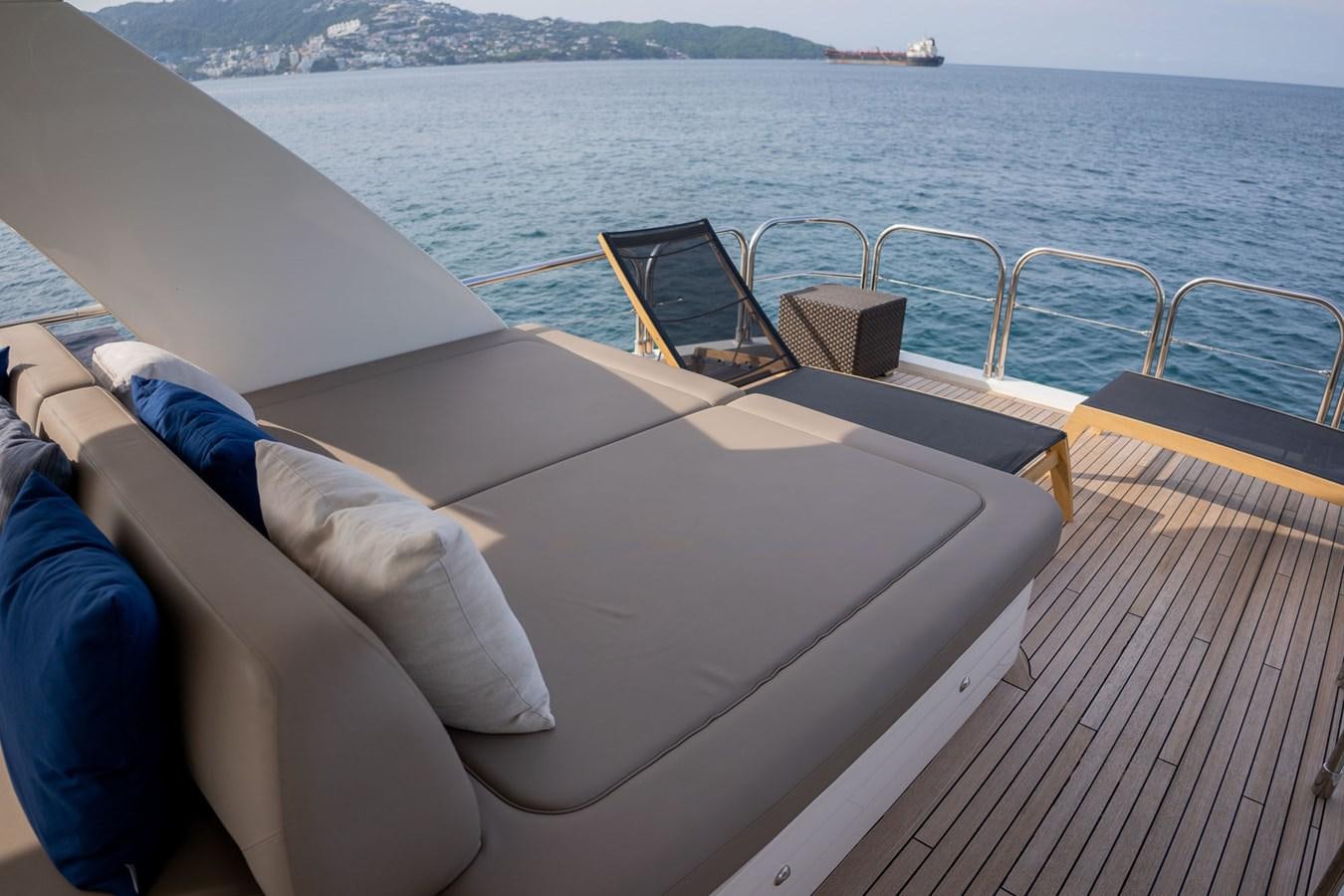 a person lying on a boat aboard PICHOS III Yacht for Sale