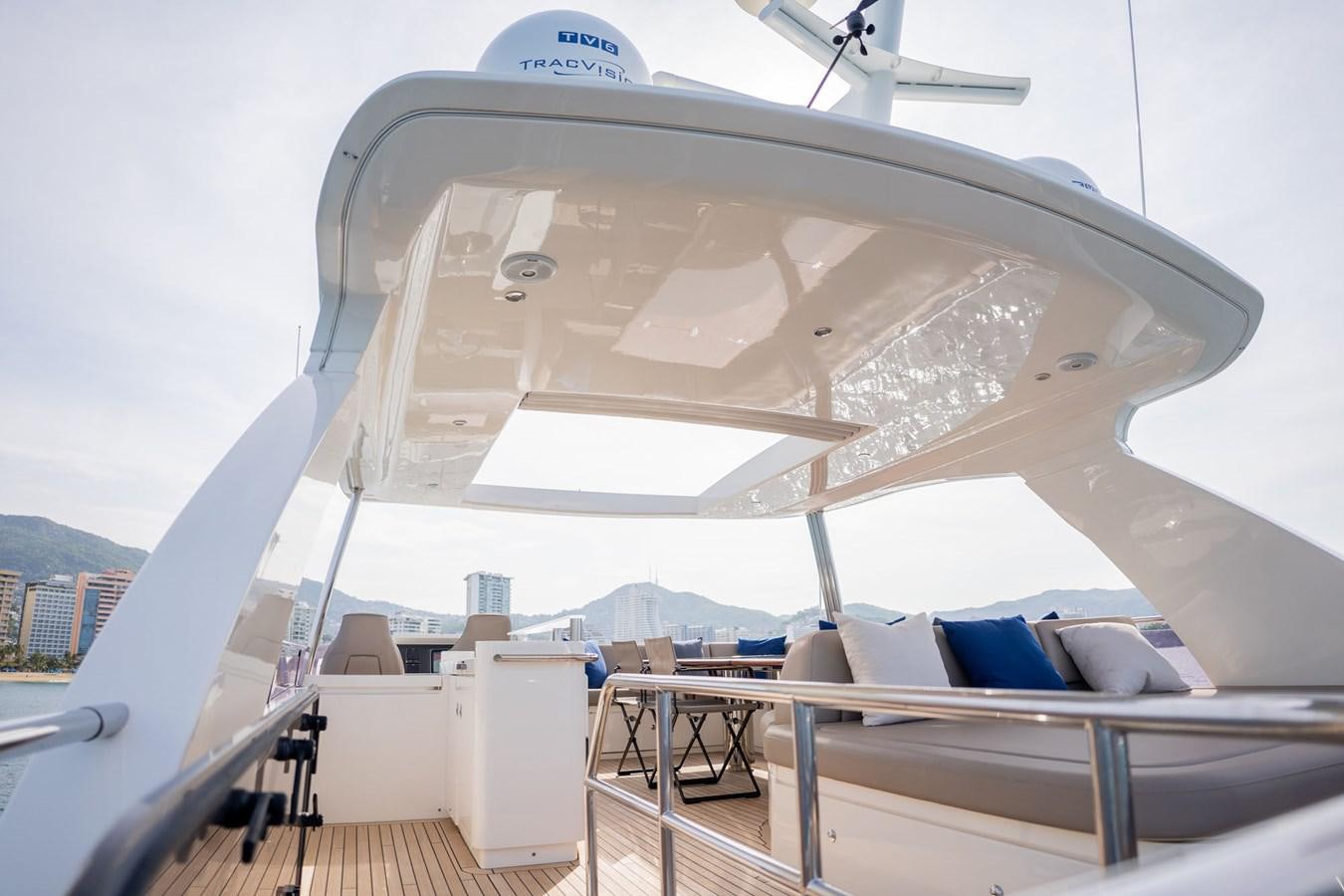 a large white tent with a blue and white roof and a white roof aboard PICHOS III Yacht for Sale