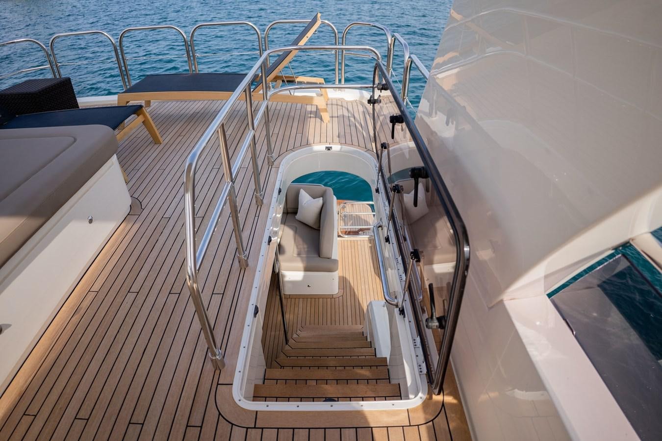 a boat with a wooden deck aboard PICHOS III Yacht for Sale