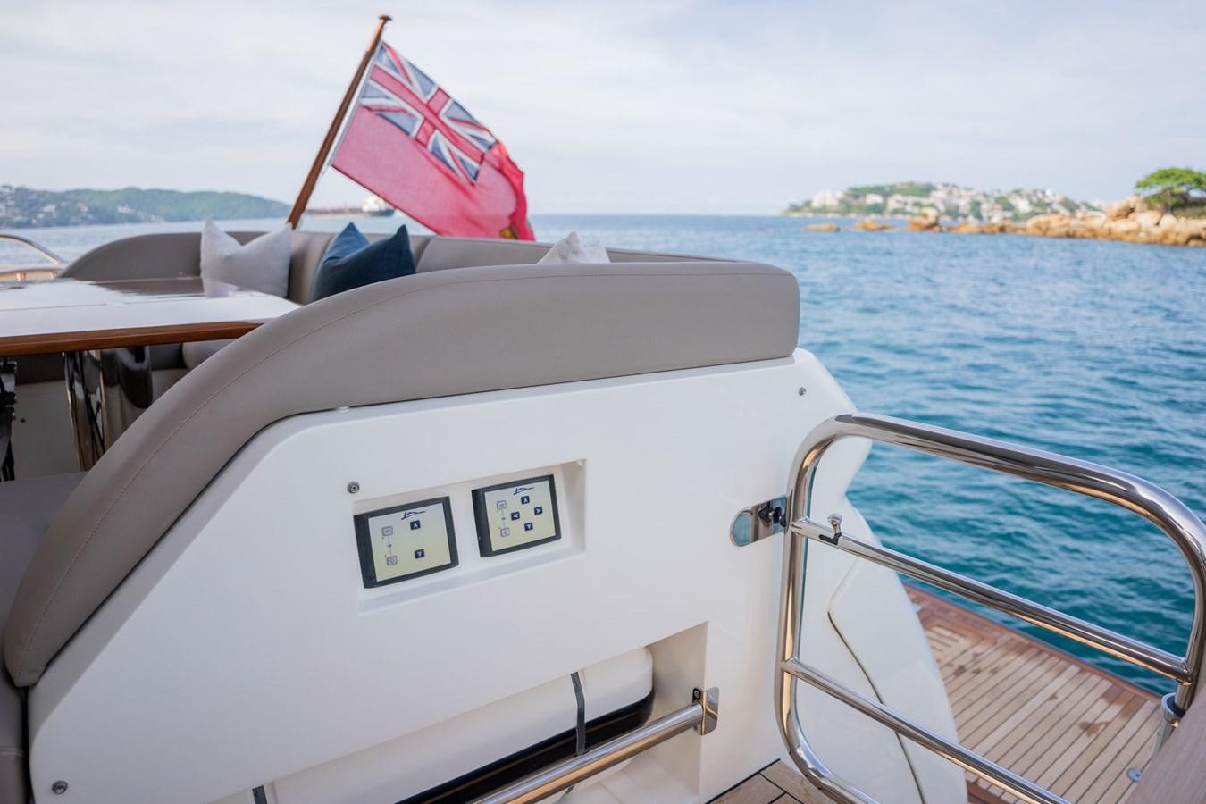 a boat with a flag on the front aboard PICHOS III Yacht for Sale