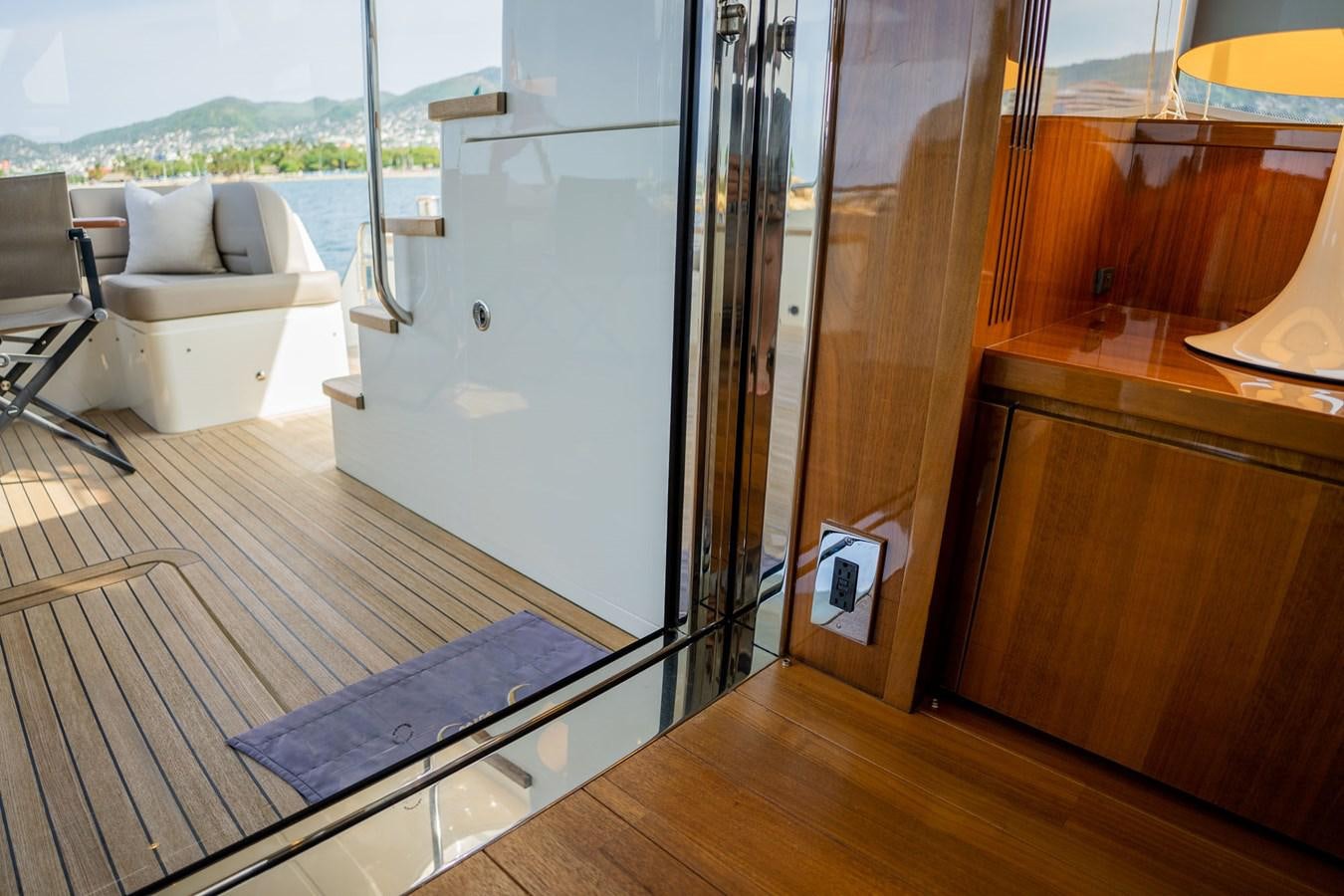 a room with a sliding door aboard PICHOS III Yacht for Sale