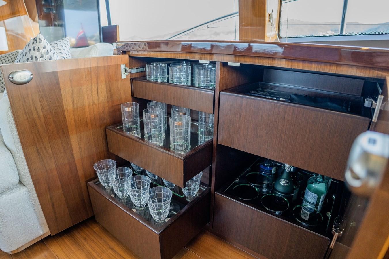a cabinet with many items in it aboard PICHOS III Yacht for Sale