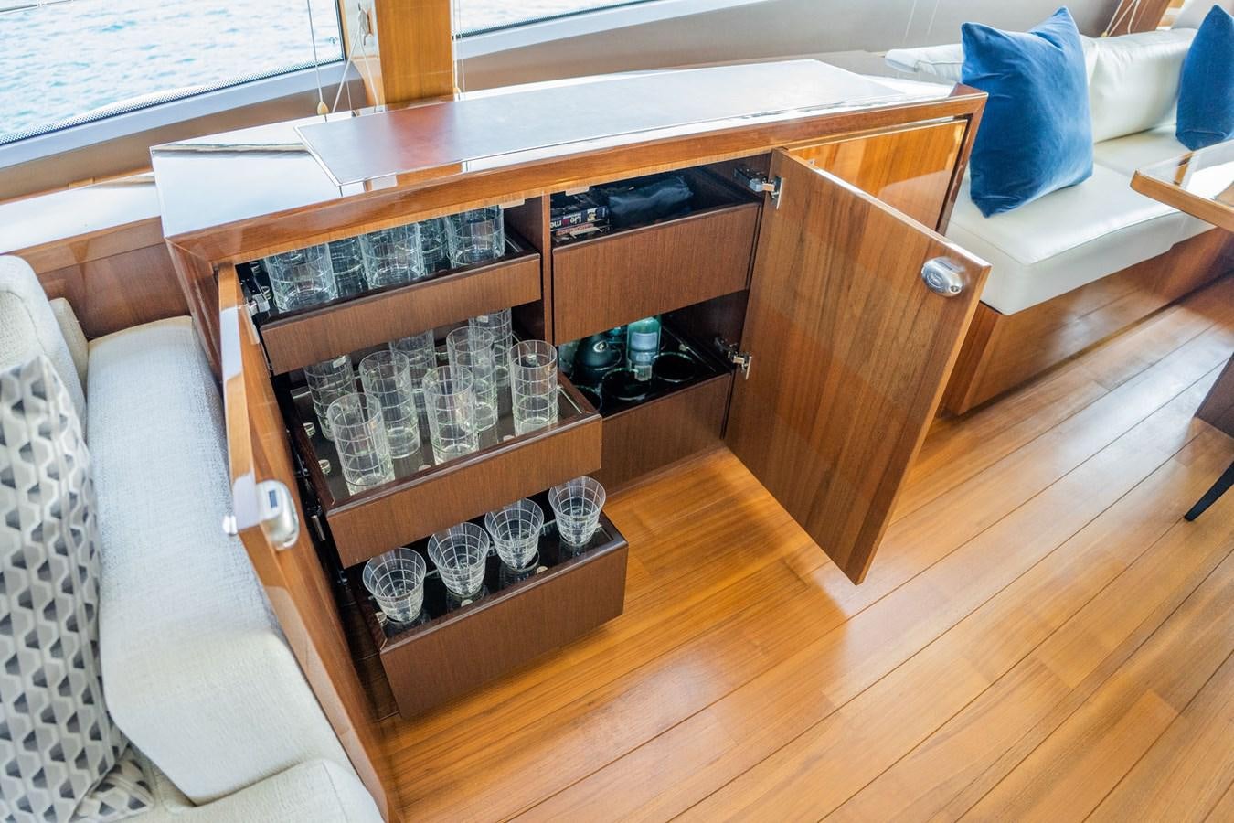 a shelf with a bookcase aboard PICHOS III Yacht for Sale