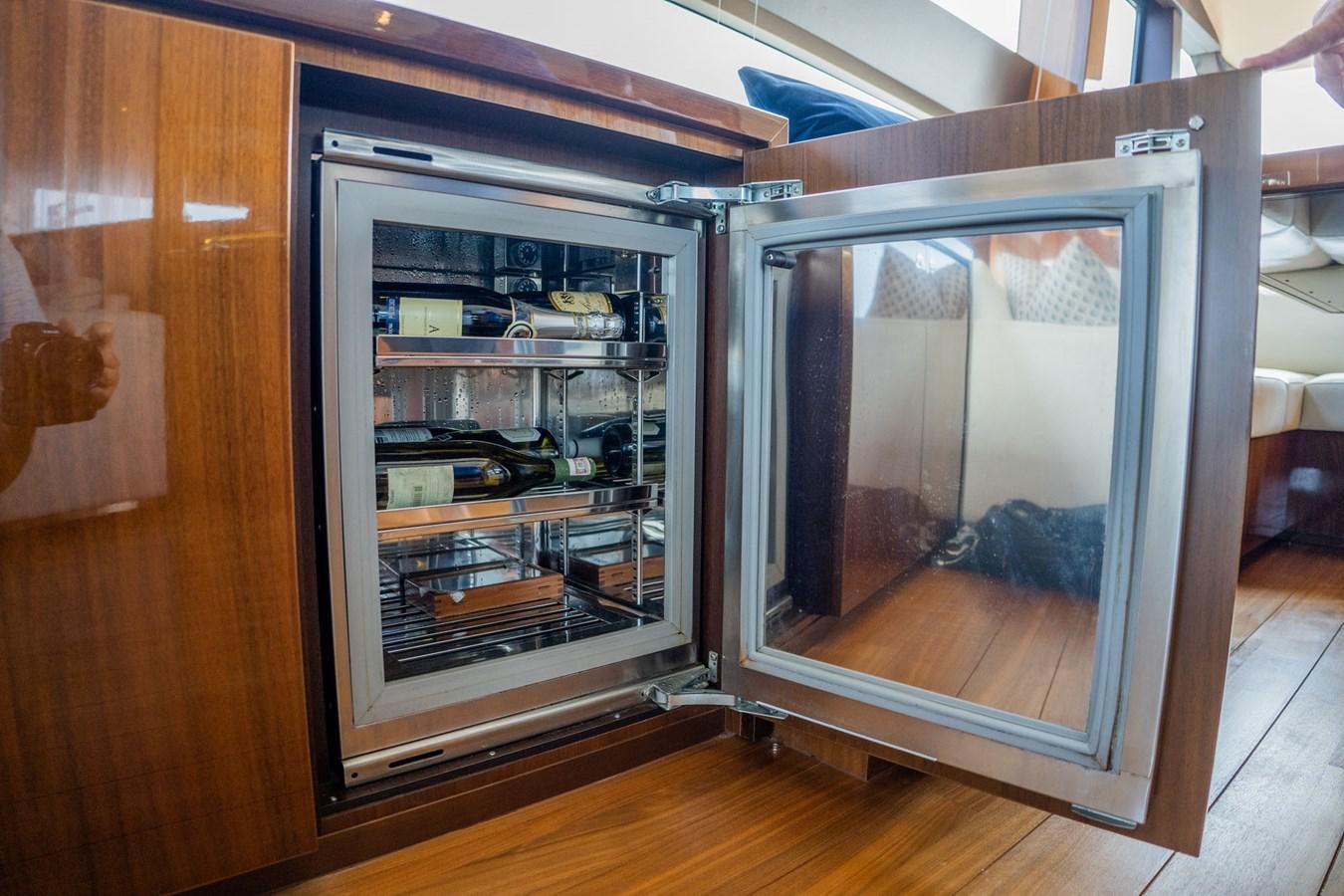 a cabinet with glass doors aboard PICHOS III Yacht for Sale