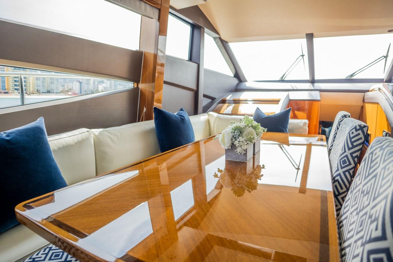 a room with a couch and a table and chairs aboard PICHOS III Yacht for Sale