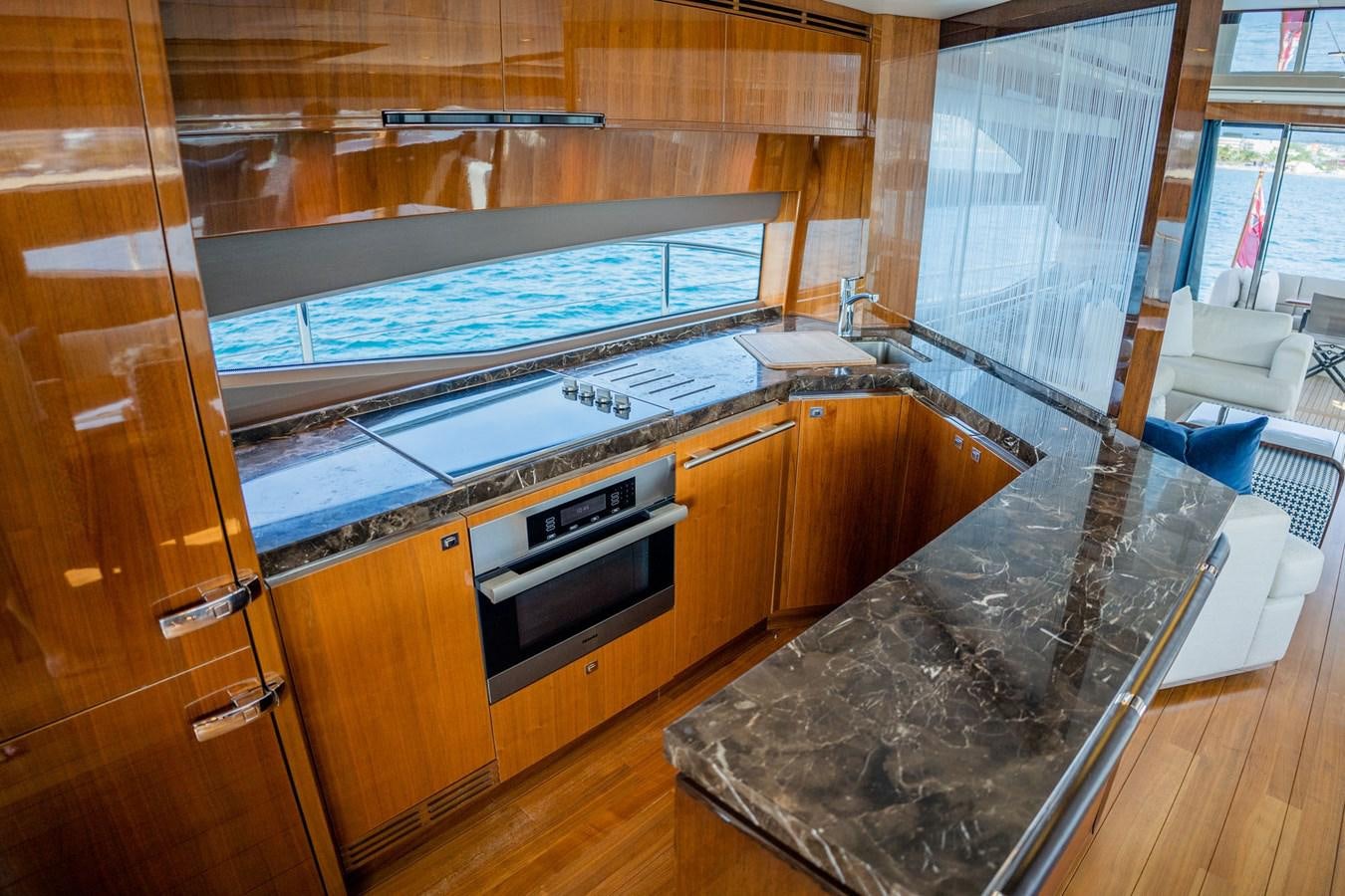 a kitchen with a large island aboard PICHOS III Yacht for Sale