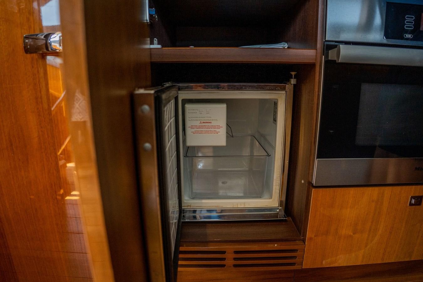 a microwave oven with a door open aboard PICHOS III Yacht for Sale