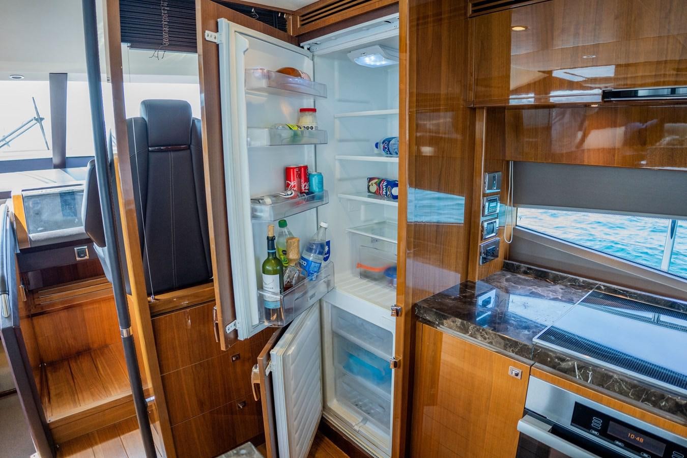 a refrigerator with a glass door aboard PICHOS III Yacht for Sale