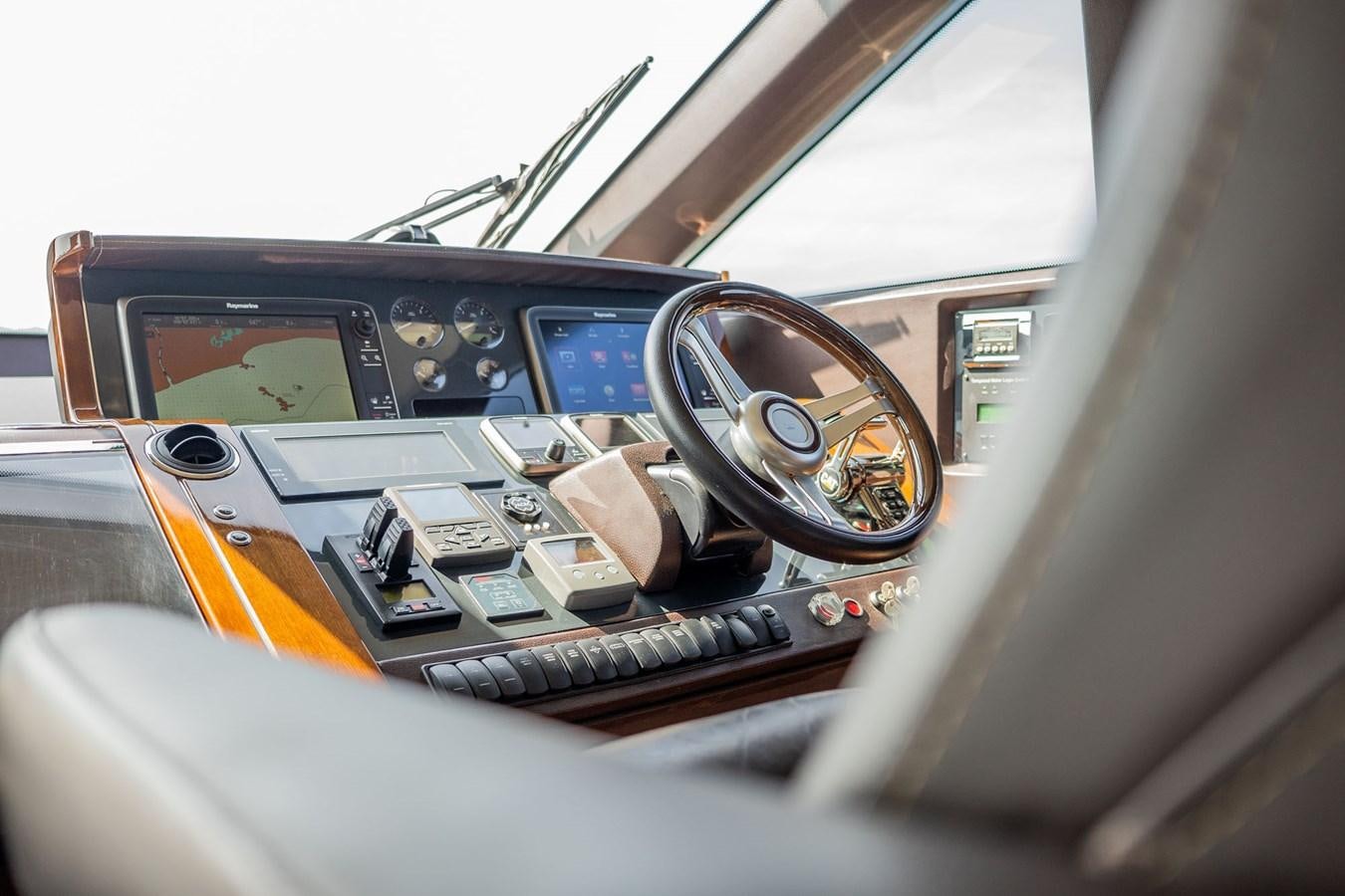 the inside of a car aboard PICHOS III Yacht for Sale