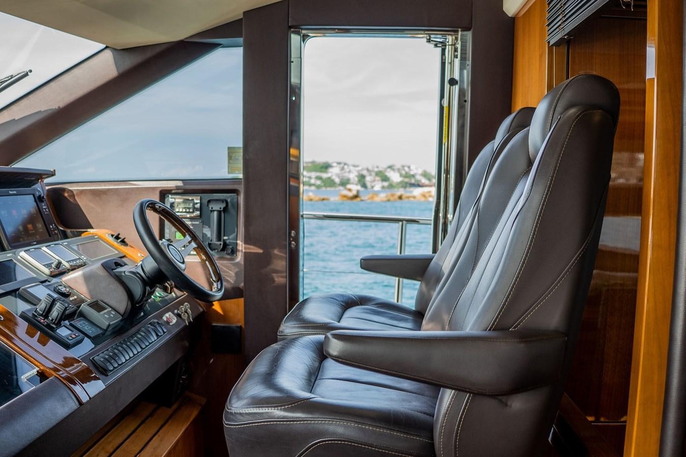 a leather chair in a vehicle aboard PICHOS III Yacht for Sale