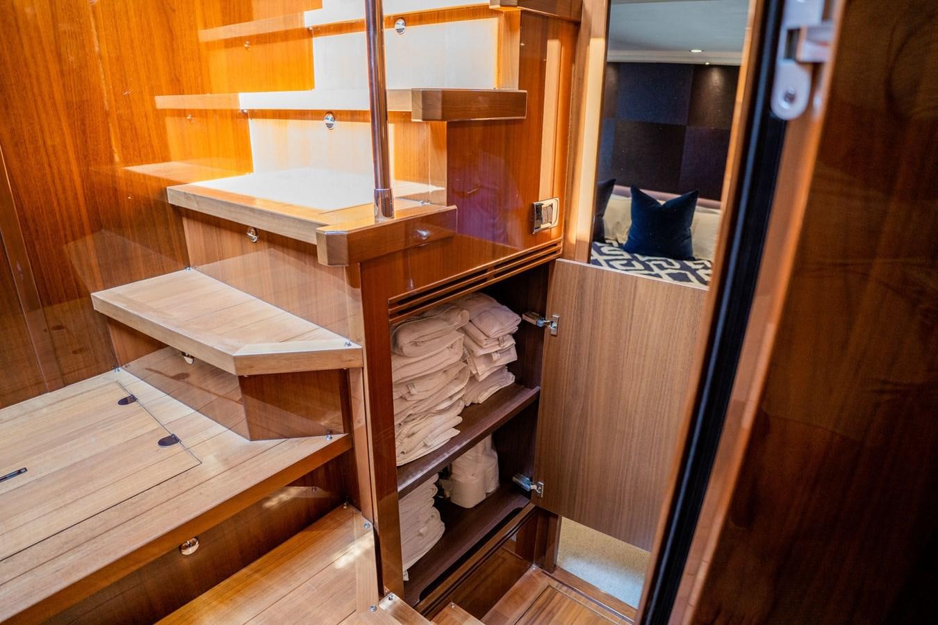 a wooden bunk bed with a wooden frame aboard PICHOS III Yacht for Sale