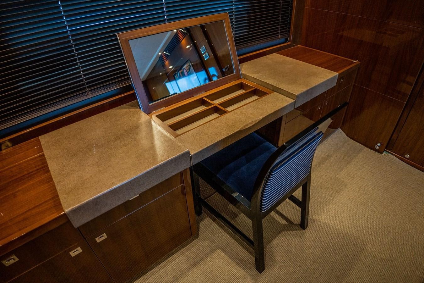 a chair and a table in a room aboard PICHOS III Yacht for Sale