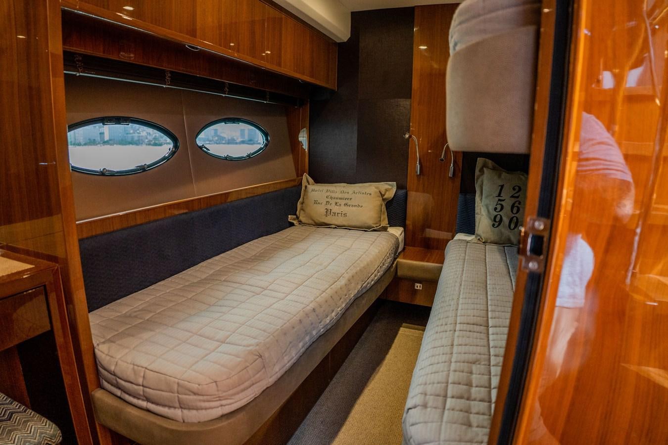 a bed with a white sheet aboard PICHOS III Yacht for Sale