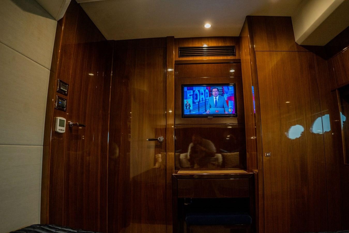 a tv on a cabinet aboard PICHOS III Yacht for Sale