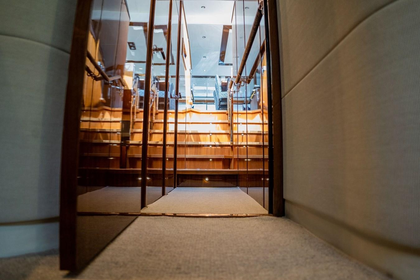 a hallway with a door aboard PICHOS III Yacht for Sale