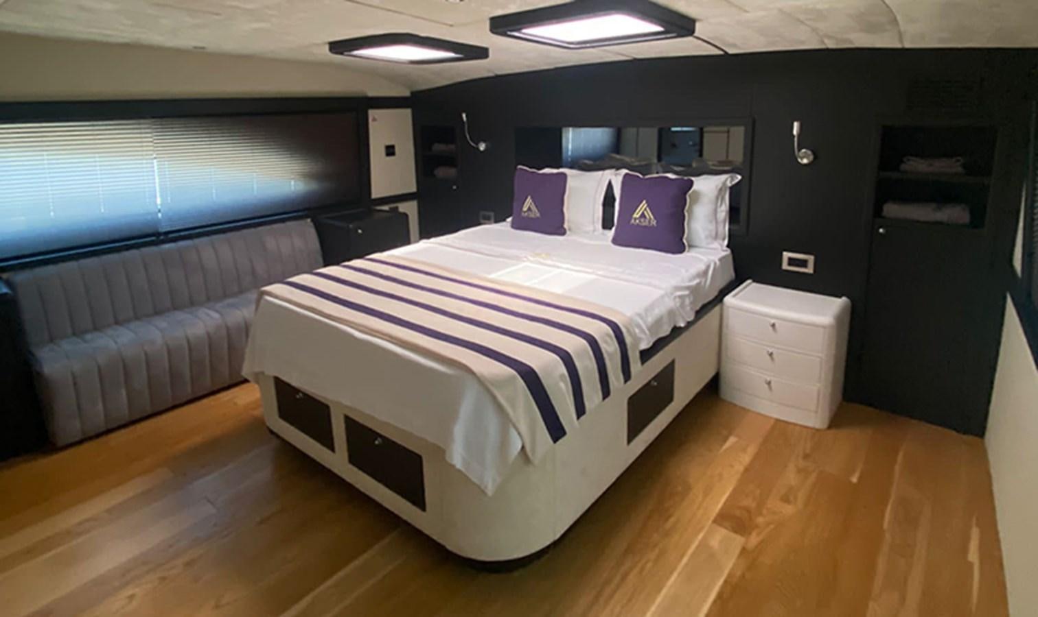 a bed in a room aboard AKSER Yacht for Sale