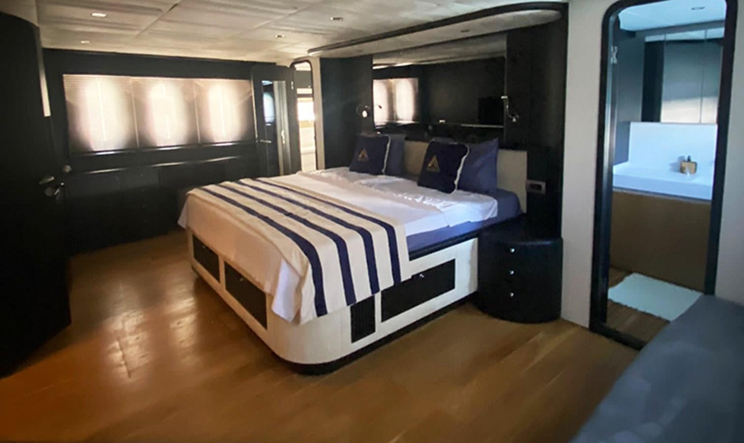 a bed in a room aboard AKSER Yacht for Sale