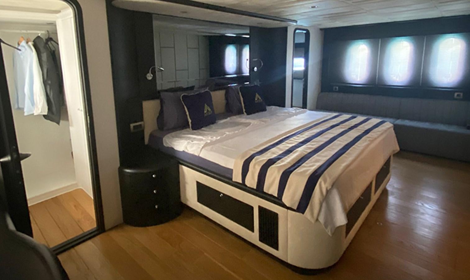 a bed in a room aboard AKSER Yacht for Sale