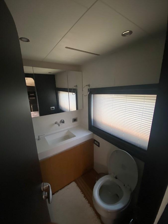 a bathroom with a toilet and bathtub aboard AKSER Yacht for Sale