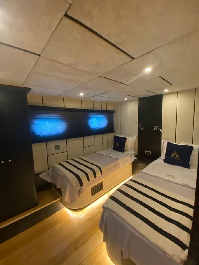 a room with a bed and a tv aboard AKSER Yacht for Sale