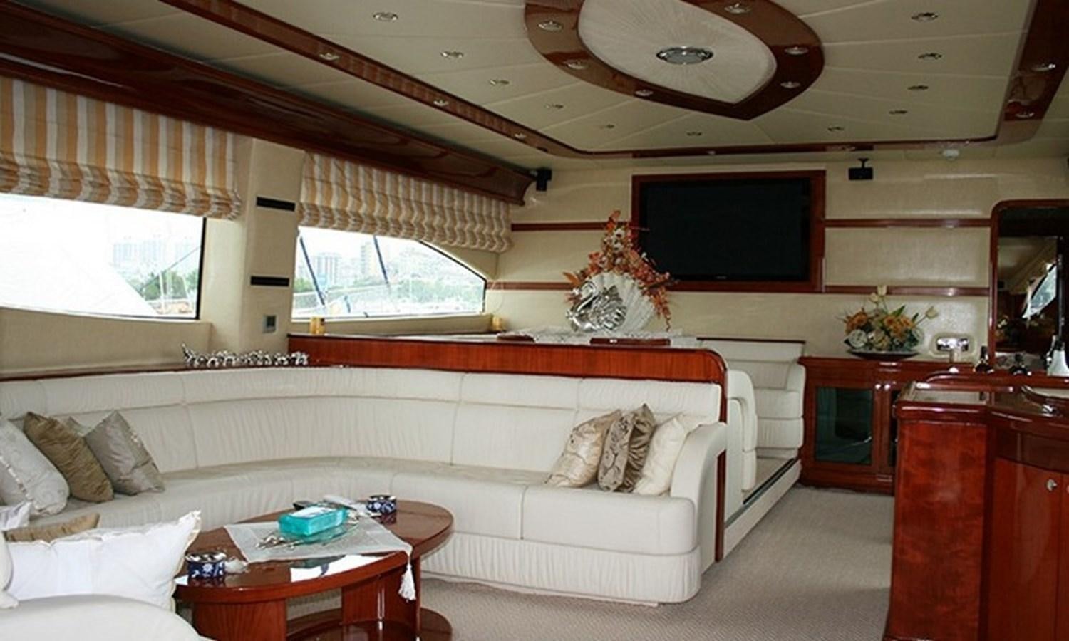 a living room with a white couch aboard CORAL Yacht for Sale