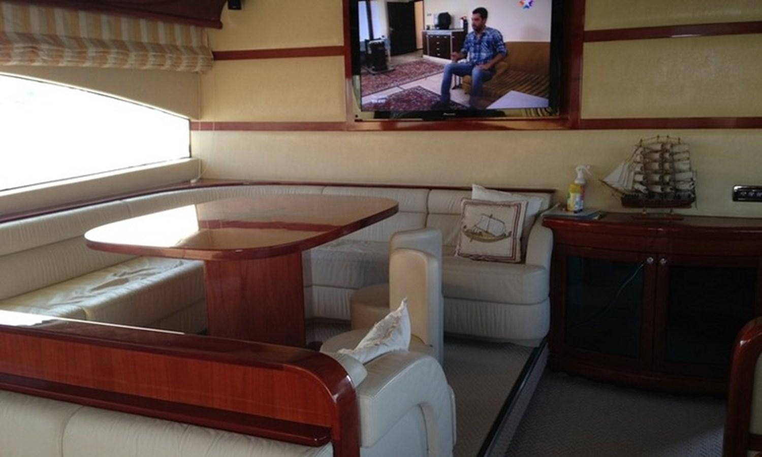 a room with a mirror and couches aboard CORAL Yacht for Sale