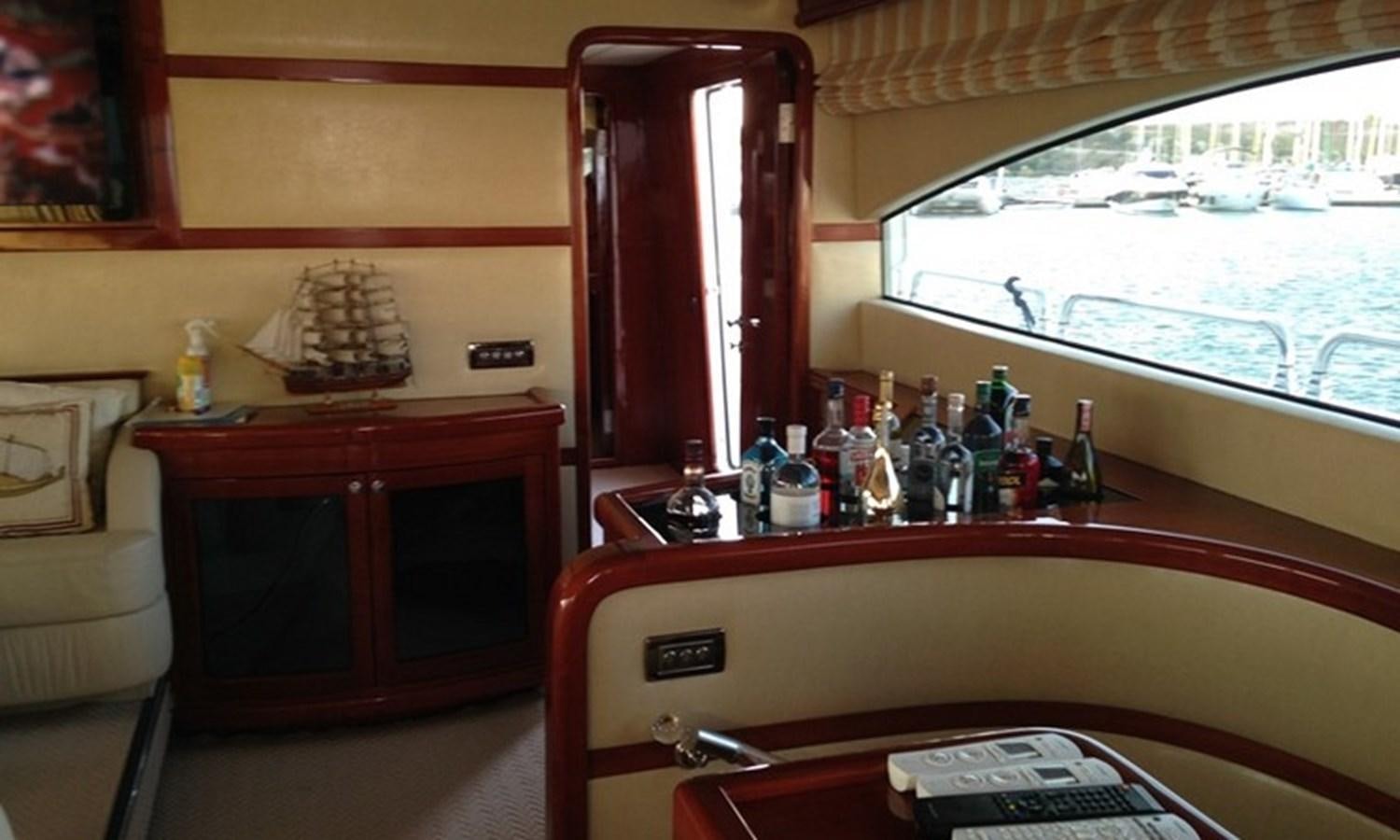 a room with a desk and a phone on the table aboard CORAL Yacht for Sale