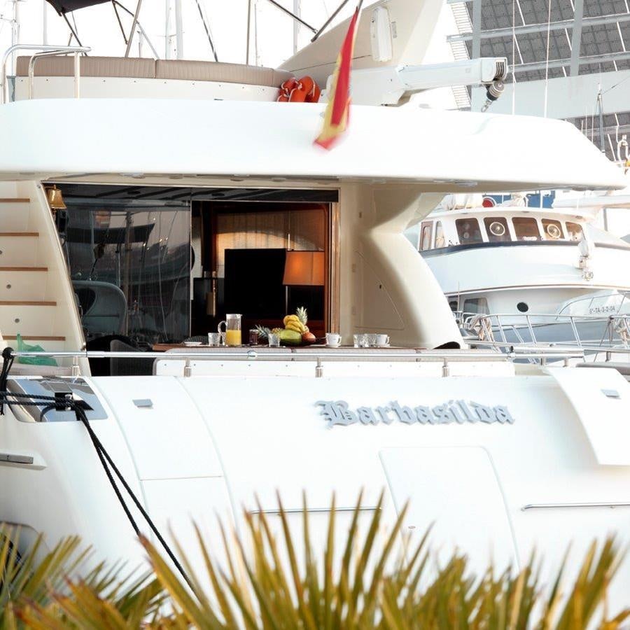 a white boat with a red bow aboard BARBASILDA Yacht for Sale