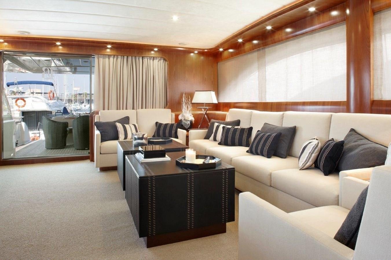 a living room with a large window aboard BARBASILDA Yacht for Sale
