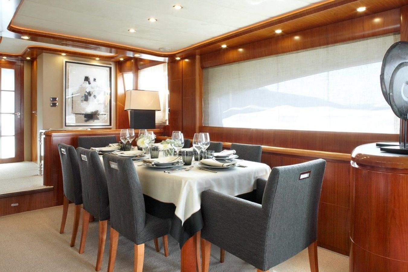 a dining room with a table and chairs aboard BARBASILDA Yacht for Sale