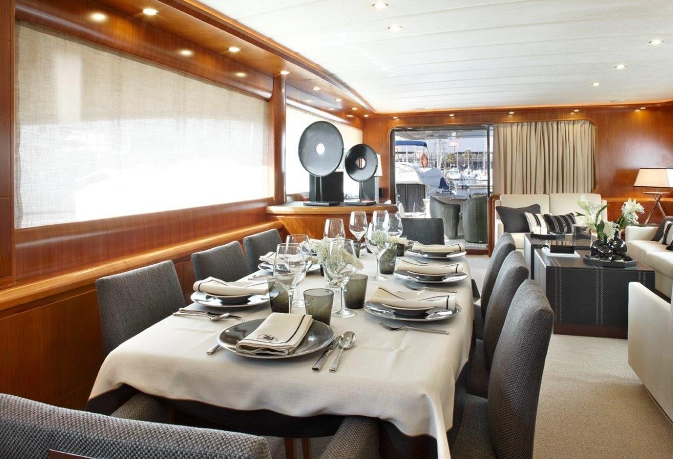 a dining room with a table set aboard BARBASILDA Yacht for Sale