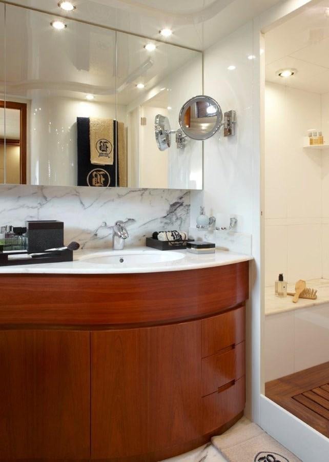 a bathroom with a sink and a mirror aboard BARBASILDA Yacht for Sale
