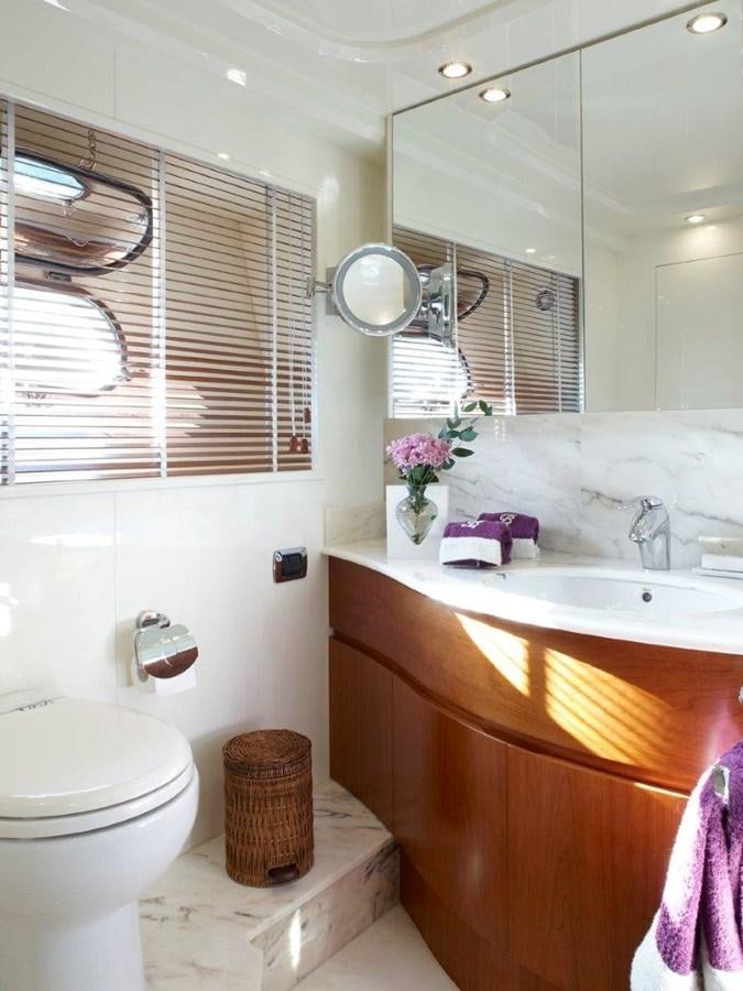 a bathroom with a toilet and a sink aboard BARBASILDA Yacht for Sale
