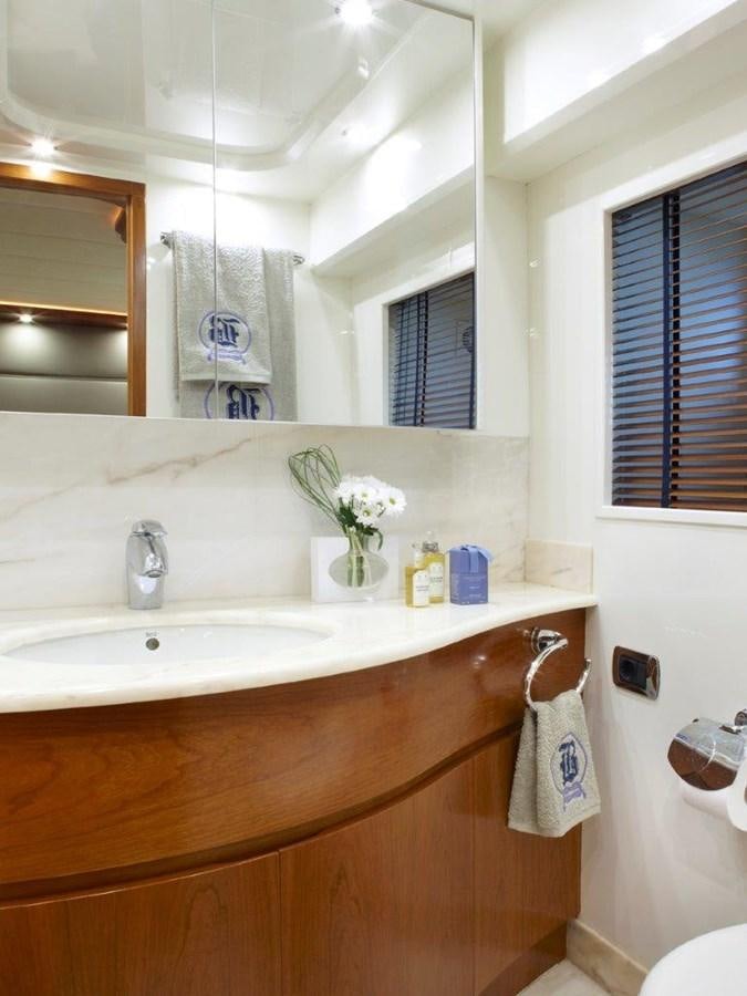 a bathroom with a sink and mirror aboard BARBASILDA Yacht for Sale