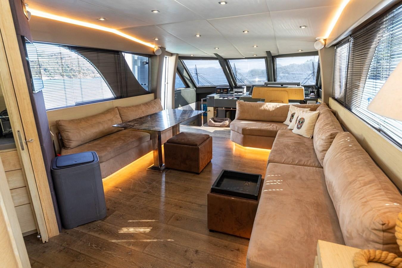 a living room with a couch and a coffee table aboard WATER Yacht for Sale
