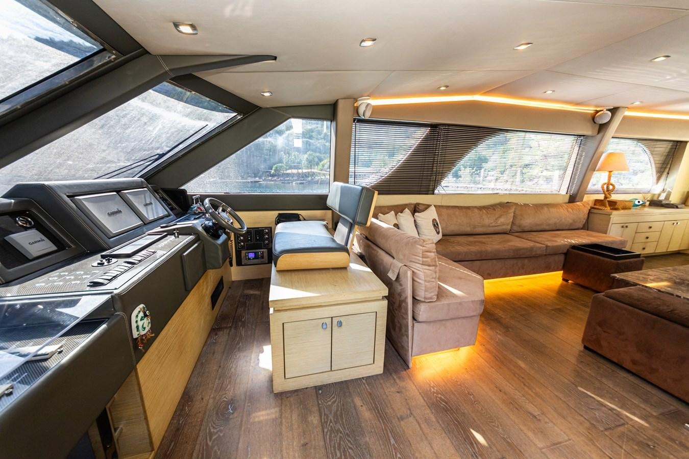 inside of a vehicle with a large window and a wood floor aboard WATER Yacht for Sale