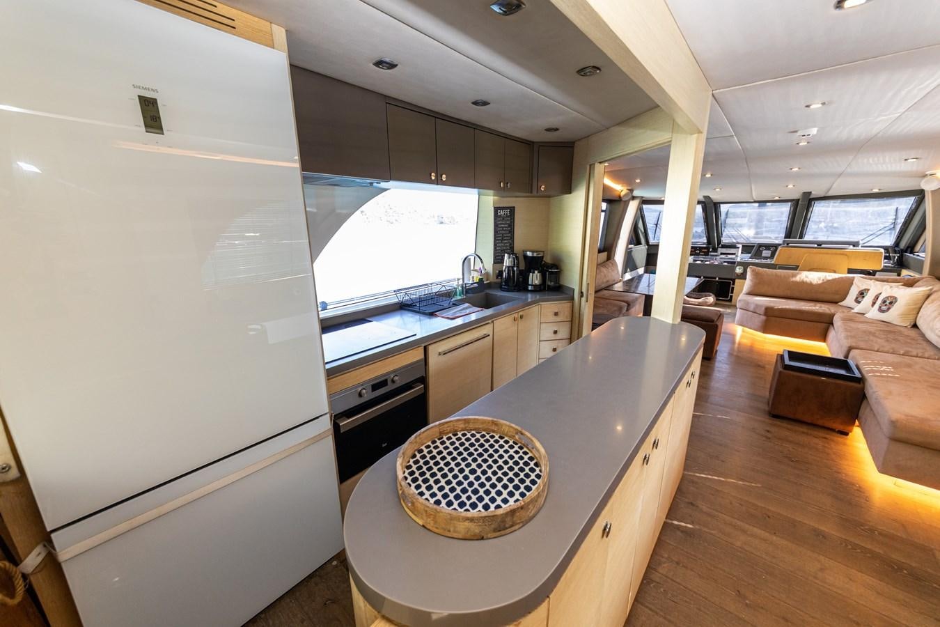 a kitchen with a large island aboard WATER Yacht for Sale