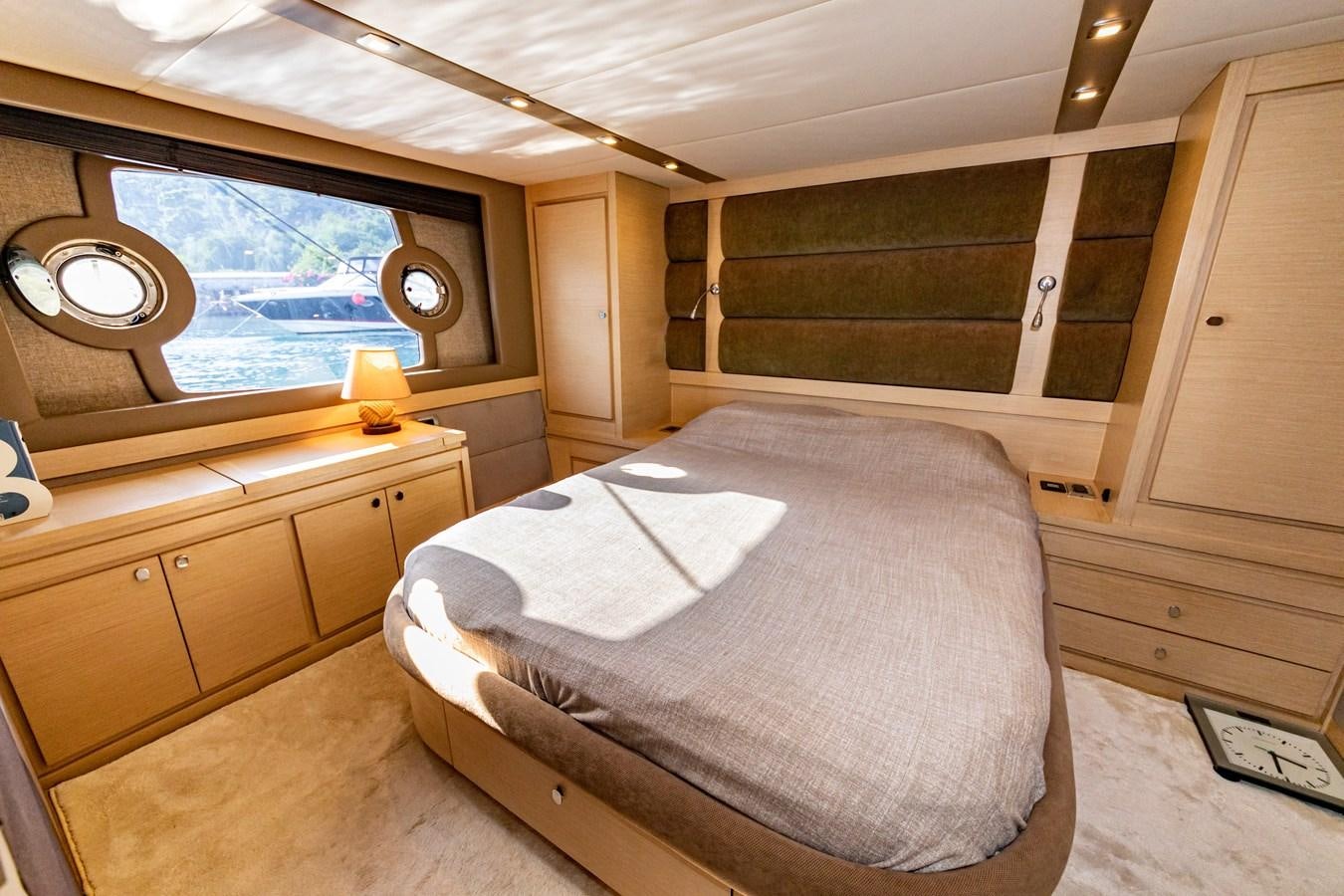 a bedroom with a large bed aboard WATER Yacht for Sale