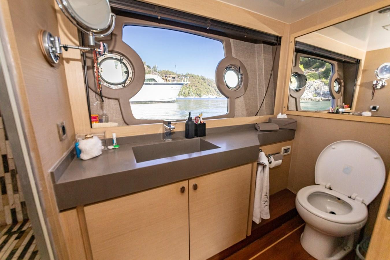 a bathroom with a large window aboard WATER Yacht for Sale
